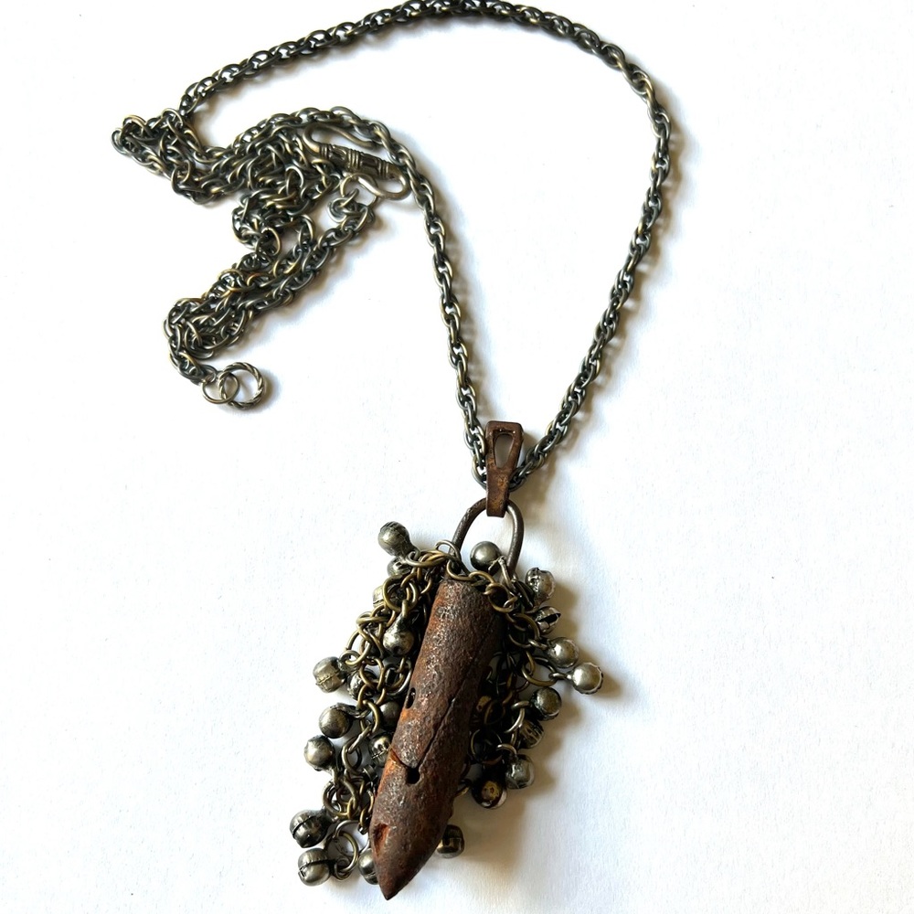 Antique repurposed (sewing machine) bobbin pendent necklace.